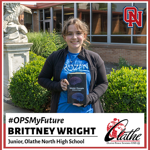 Brittany Wright holds her book outside Olathe North High School
